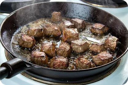 Cattle grazing in golden hour ranch landscape